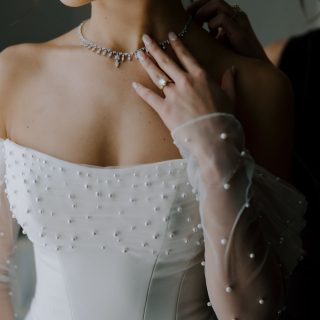 The wedding morning began with a soft, intimate energy as Consuela got ready adorned in delicate lace before slipping into her dress — a sculptural gown with sheer pearl-dotted sleeves and a beautifully modern silhouette. It was romantic without being overly traditional, fashion-forward without feeling fussy, and completely perfect for the tone of the day.
Meanwhile, Marcus’ classic black tuxedo set the tone for a sophisticated Vancouver wedding day. Together, their look was timeless: black tie, white florals, glowing candlelight, and that perfect blend of modern romance and old-world elegance.
Photographer: @pageandholmes
Planner: @plannedbyjill
Venue: @vancouverclub
Pet Sitter: DreamGroup — because just sometimes we do that too!
#vancouverwedding #luxuryweddings #dreamgroupplanners #vancouverweddingplanner